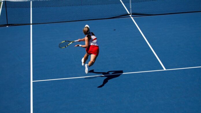 a female tennis player in action on the court